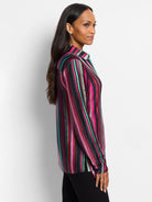 Long-sleeve shirt with vertical stripes in red, pink, teal, green, and dark gray on a black background.