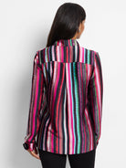 Long-sleeved shirt; multicolored vertical stripes on black background.  Predominant colors: pink, red, teal.