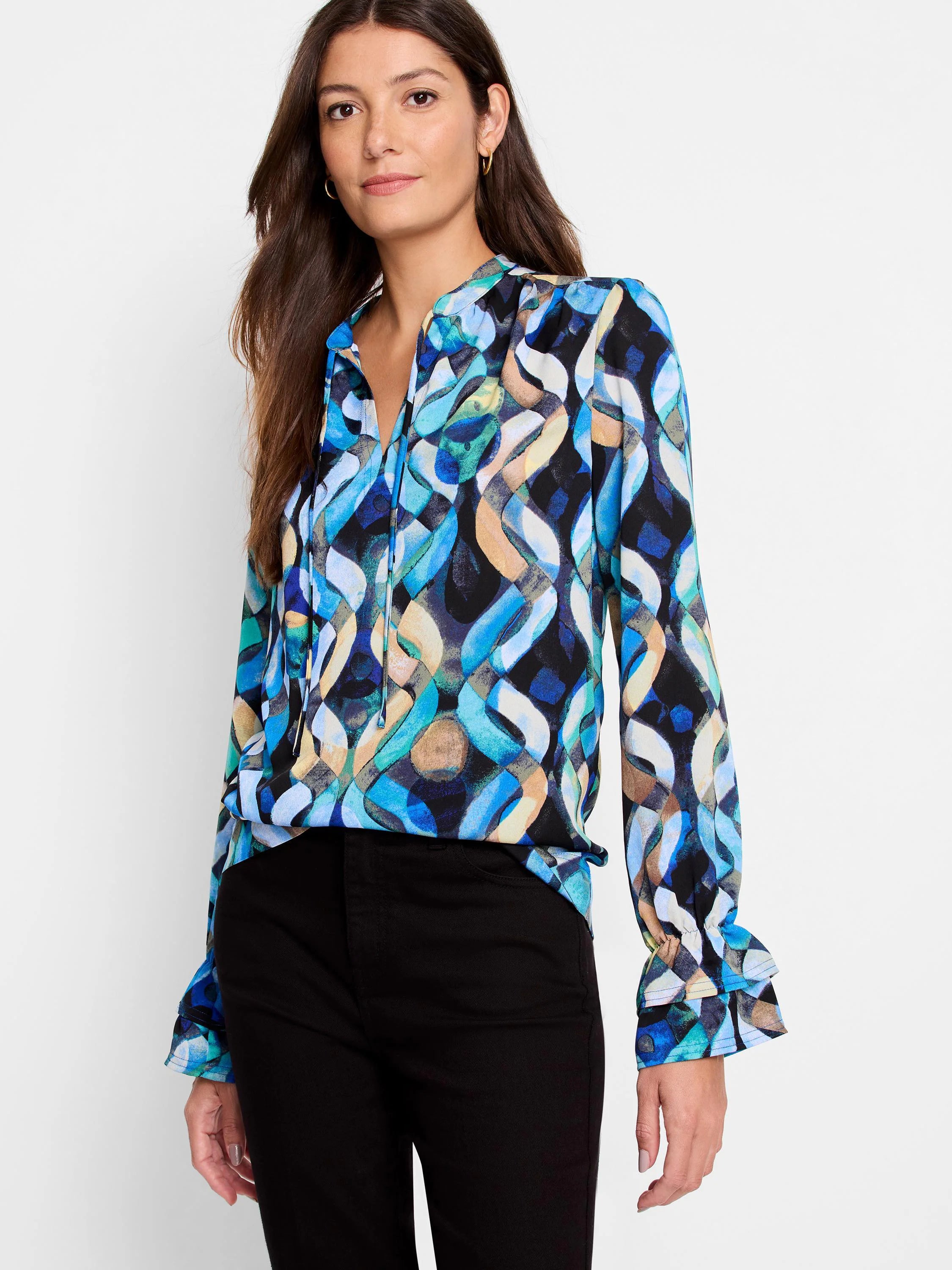 Blue, teal, beige, and black abstract print long-sleeve blouse with a V-neck and ruffled cuffs.