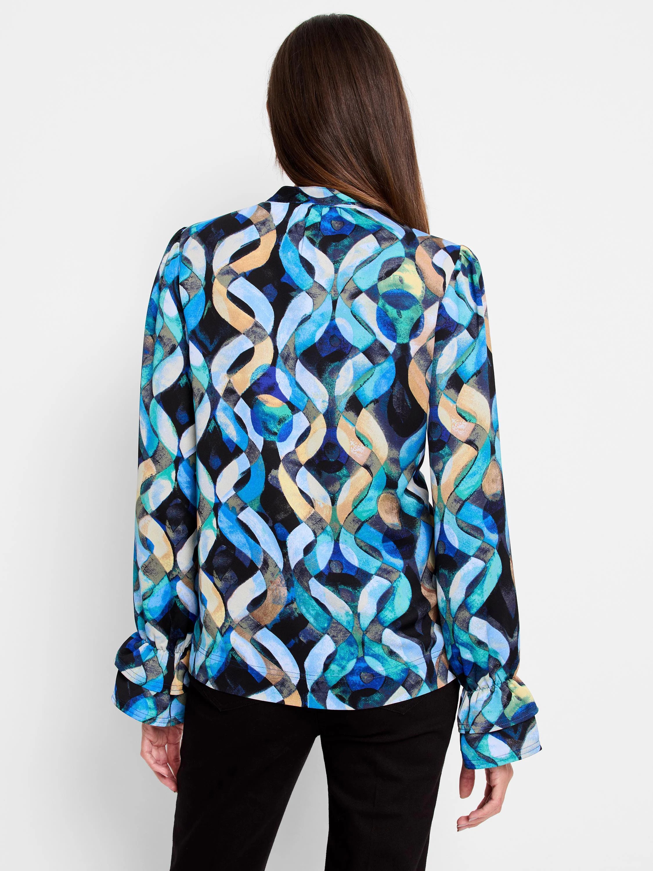 Long-sleeve top, blue, teal, and beige abstract print on black background.  Ruffled cuffs.