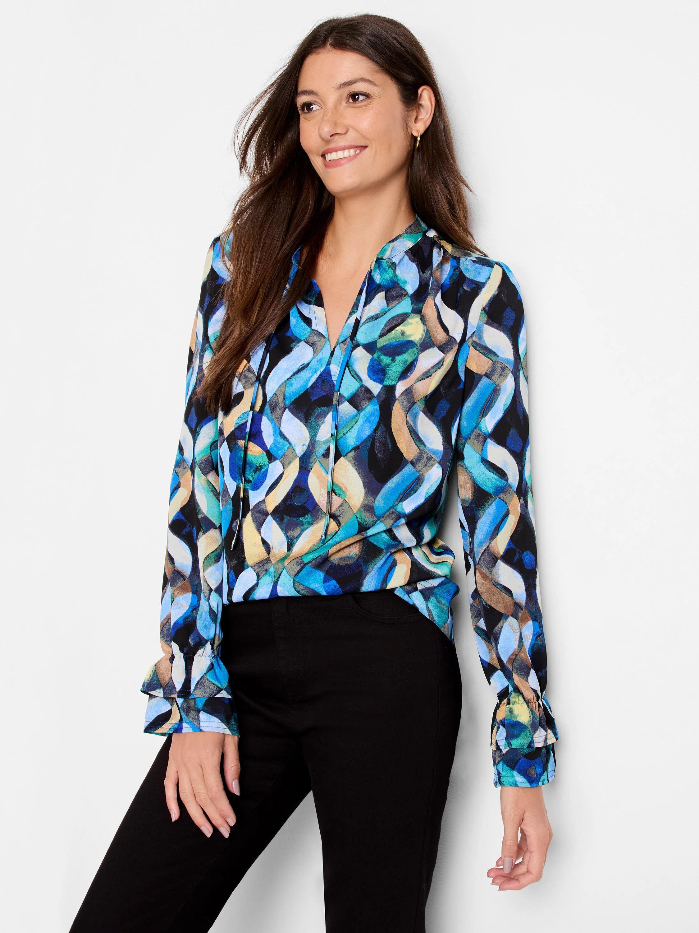 Long-sleeved blouse with blue, teal, beige, and black abstract print. V-neck, ruffled cuffs.