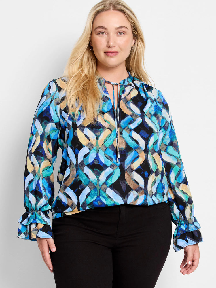 Long-sleeve blouse with keyhole neckline and double ruffled cuffs.  Blue, teal, and beige abstract print on black background.