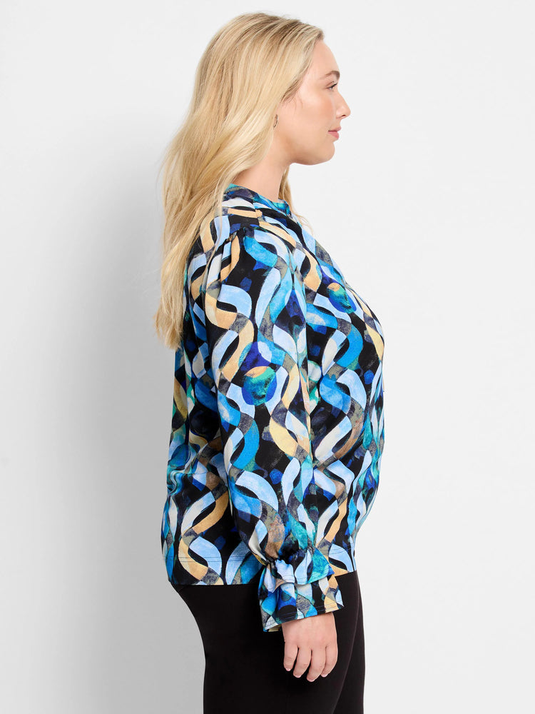 Blue, black, and beige abstract wave pattern long-sleeve top with ruffled cuffs.
