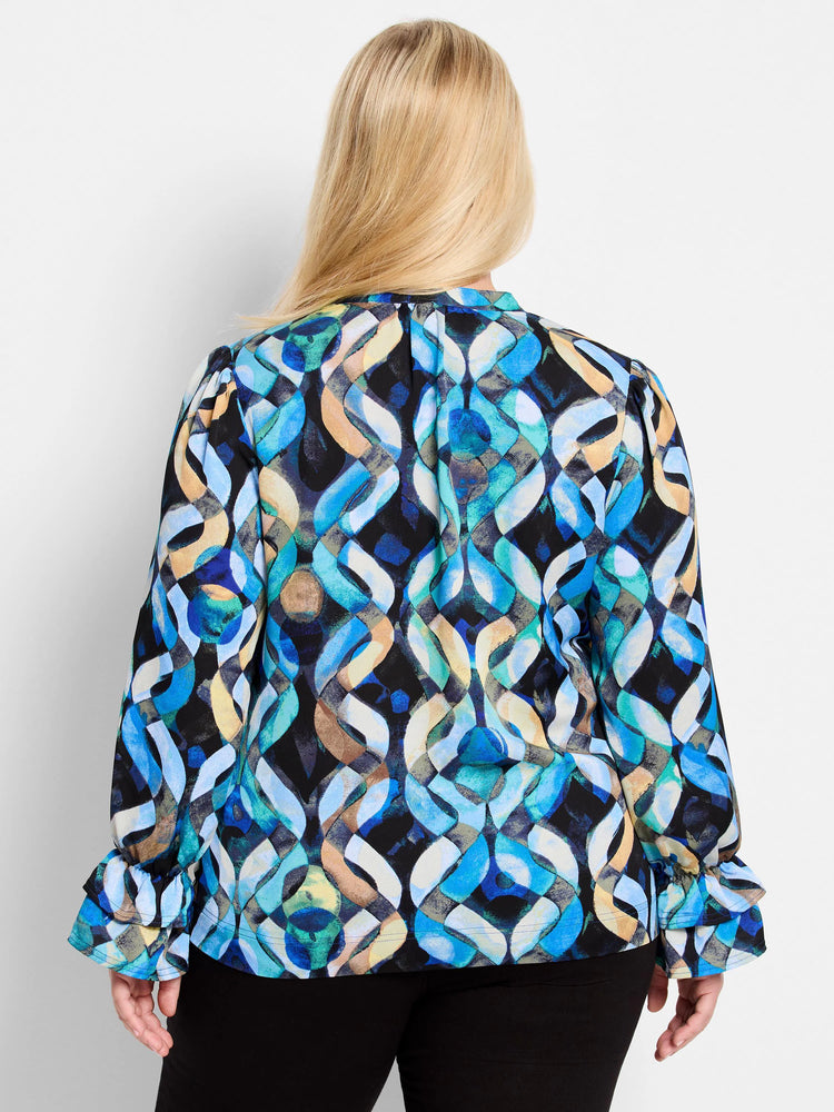 Blue, teal, beige, and black abstract print long-sleeve top with ruffled cuffs.