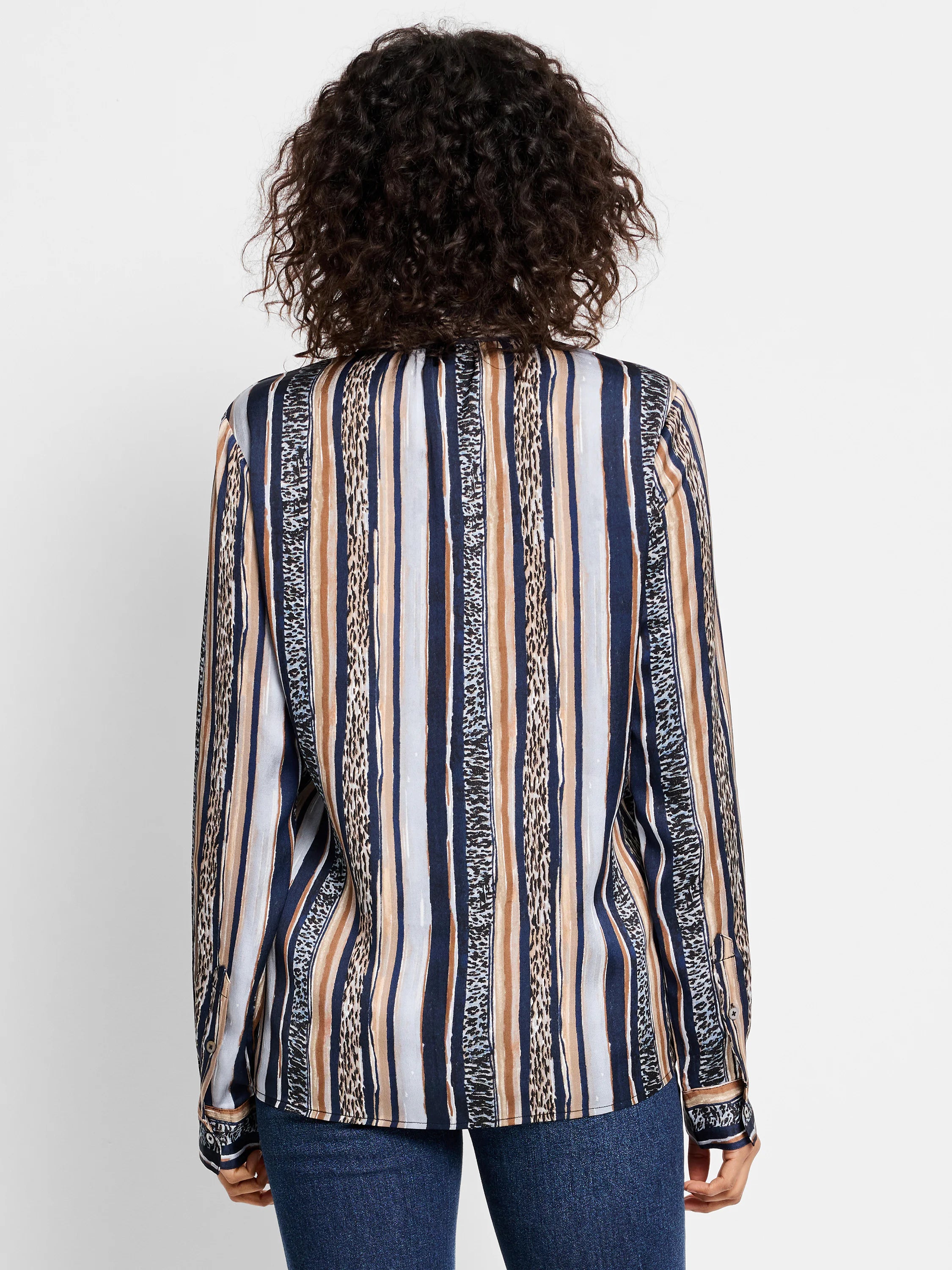 Here's alt text for the image, under 125 characters:

"Blue, beige, and brown vertical striped shirt.  Stripes...