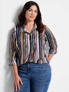Button-front shirt with vertical stripes in navy, beige, and brown.  Includes animal print details. Three-quarter sleeves.