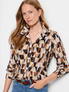 Crinkle shirt with geometric print in browns, tans, light blues, and blacks.  Long sleeves, button-front closure.
