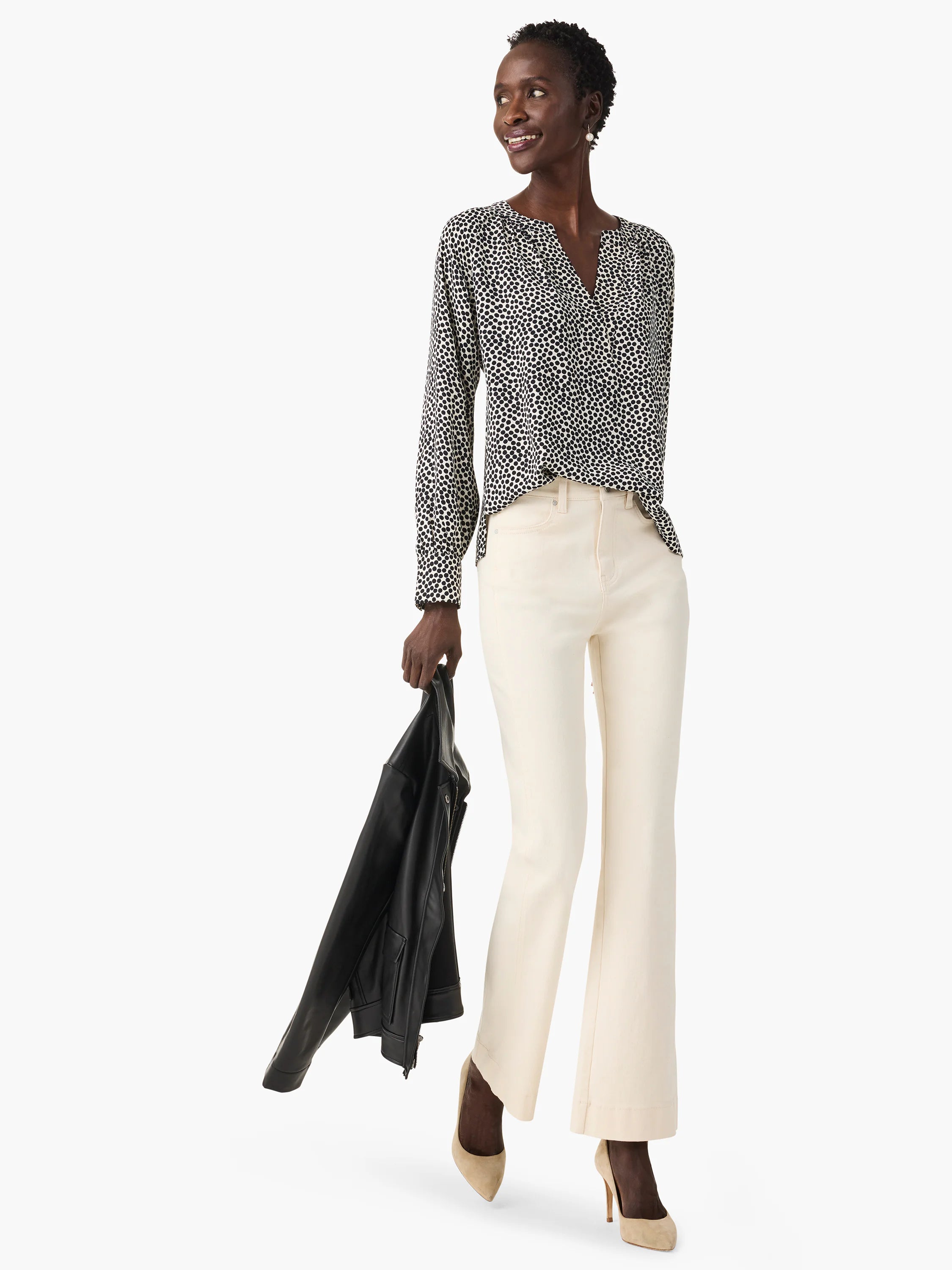 Off-white top with dark-spotted pattern, long sleeves, and V-neck.