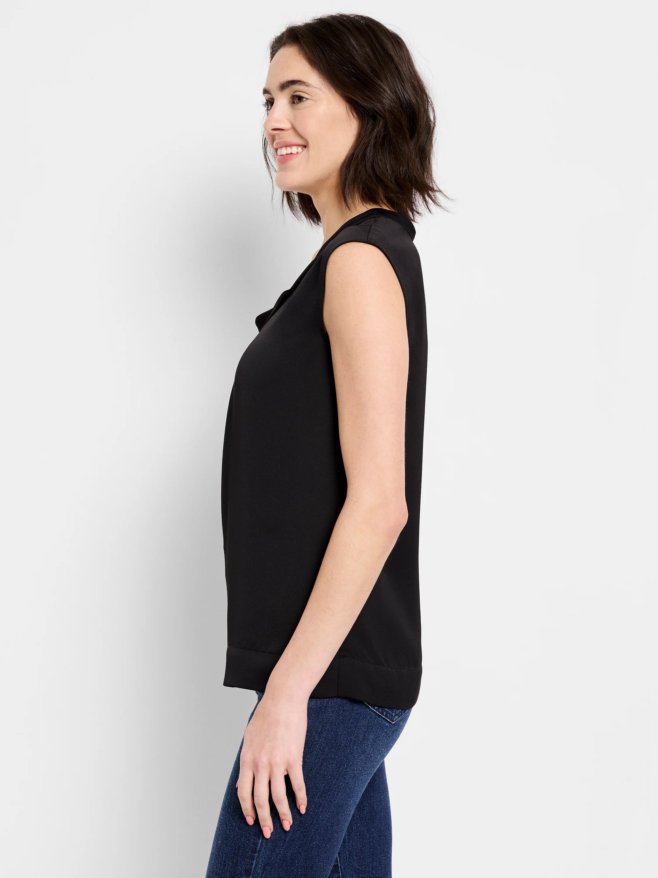 Black sleeveless satin chiffon jacket, draped neckline.