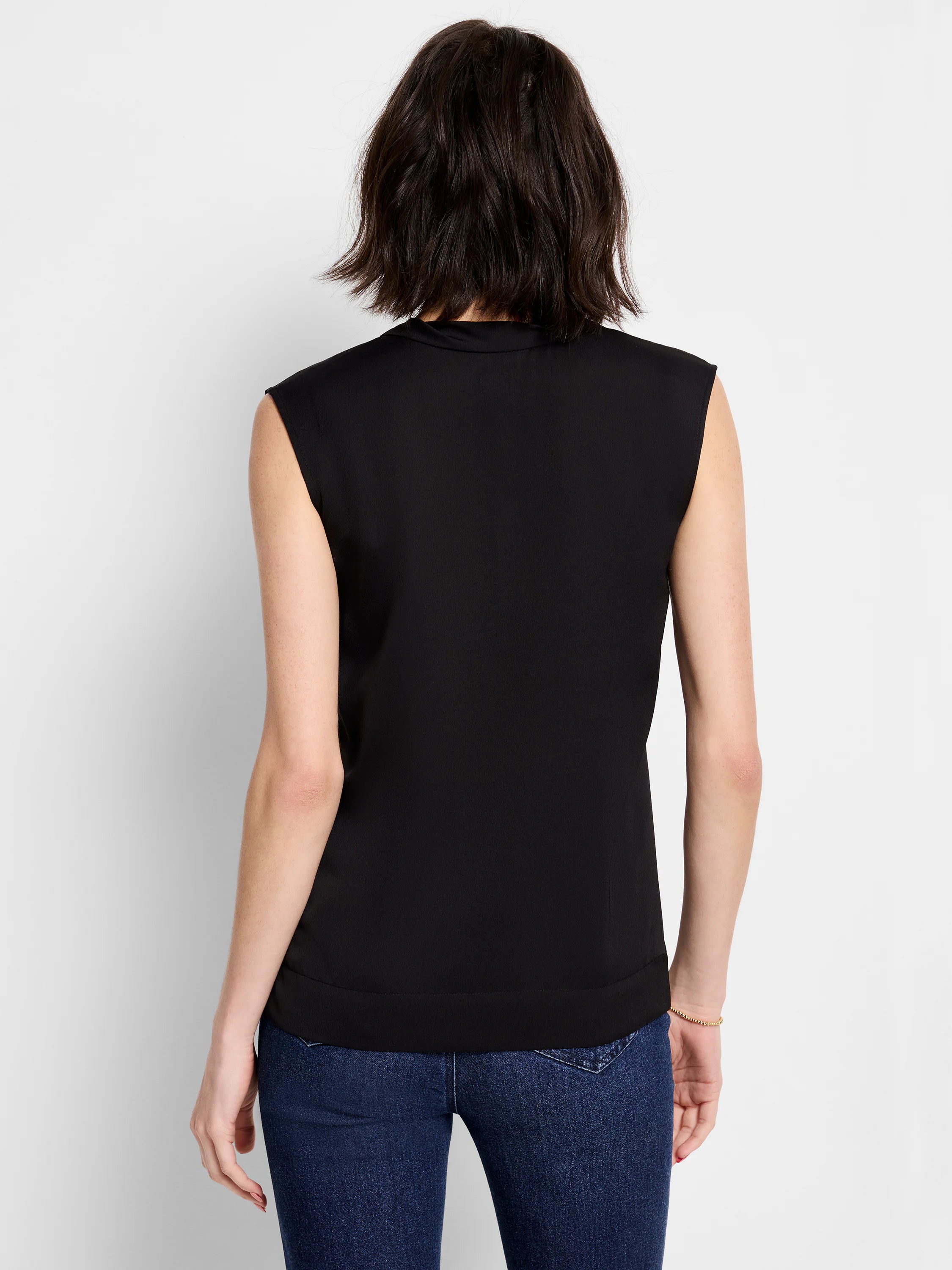 Black sleeveless jacket, shown from the back.  Straight hemline.