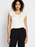 Off-white, cowl-neck, sleeveless satin top.