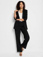 Black satin chiffon jacket and pants; three-quarter sleeves, open front.
