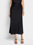 Black midi slip skirt, A-line silhouette, smooth satin-like fabric.