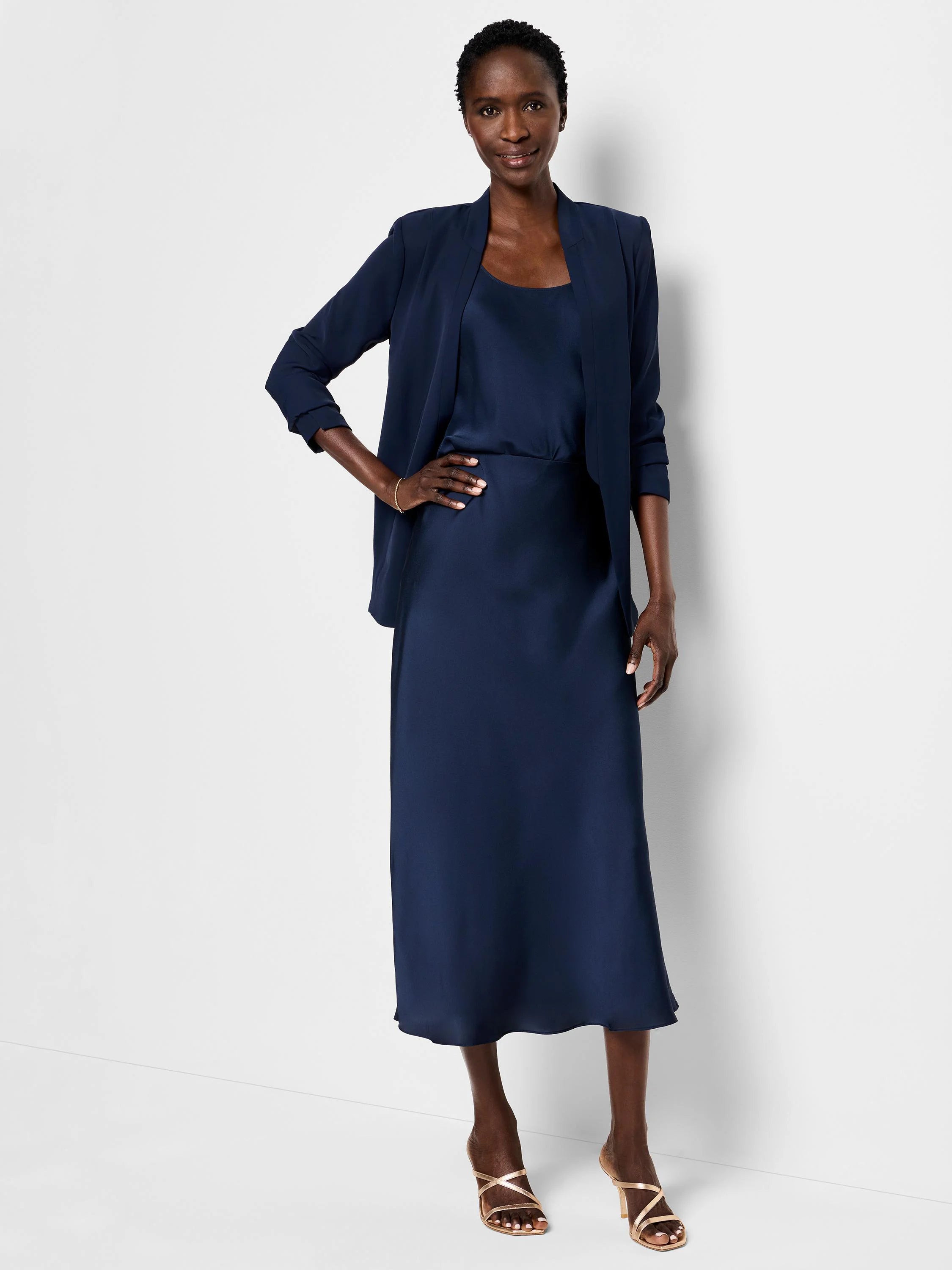 Navy blue midi-length slip skirt;  smooth, flowing fabric.