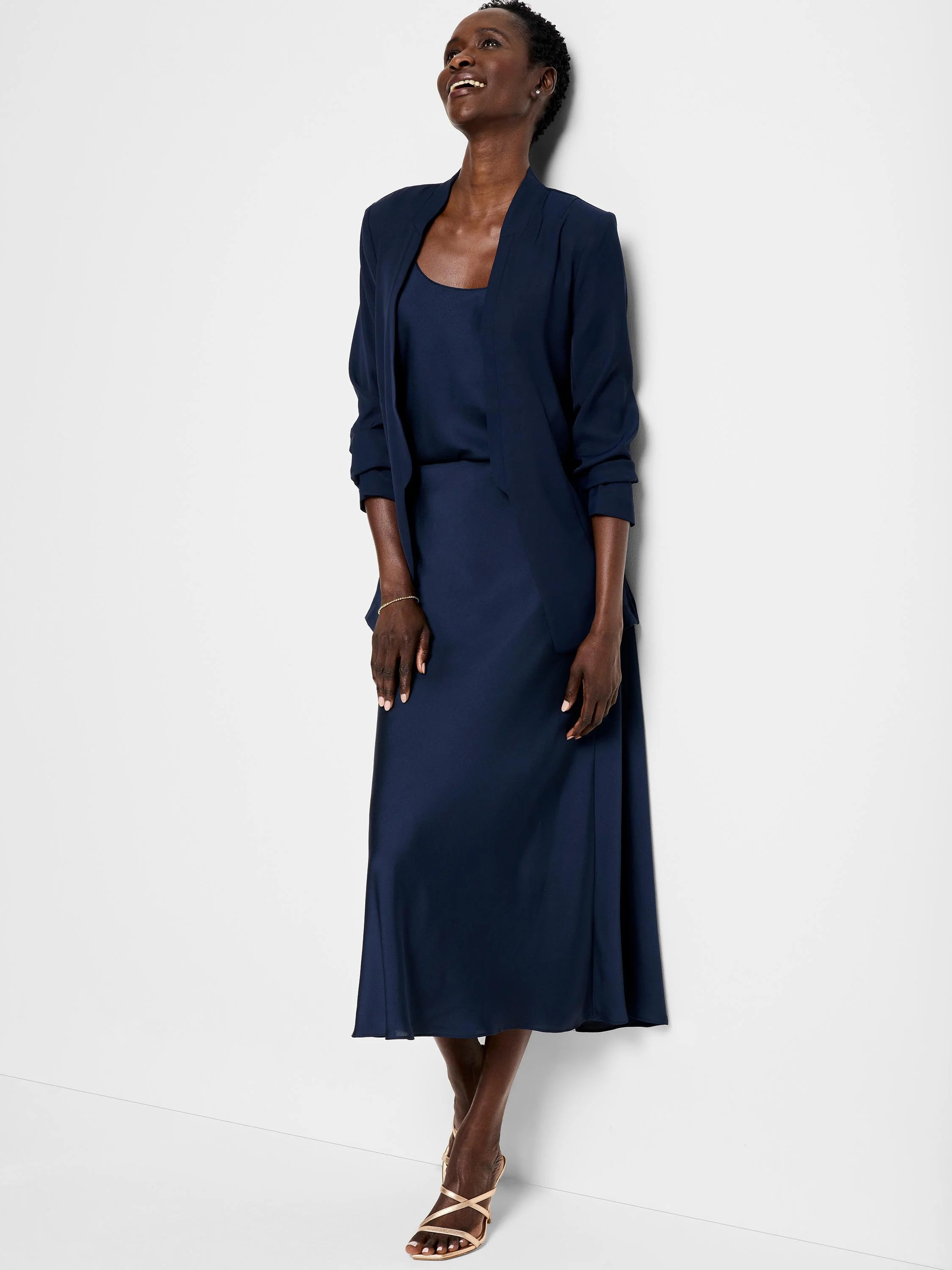 Navy blue crepe midi skirt; A-line silhouette.