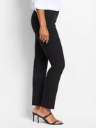Black slim-leg pull-on pants shown on a model.  Straight leg, mid-rise.