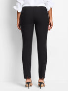 Black slim-fit pants, center seam detail, slight side slits at hem.  Shown with black heels.