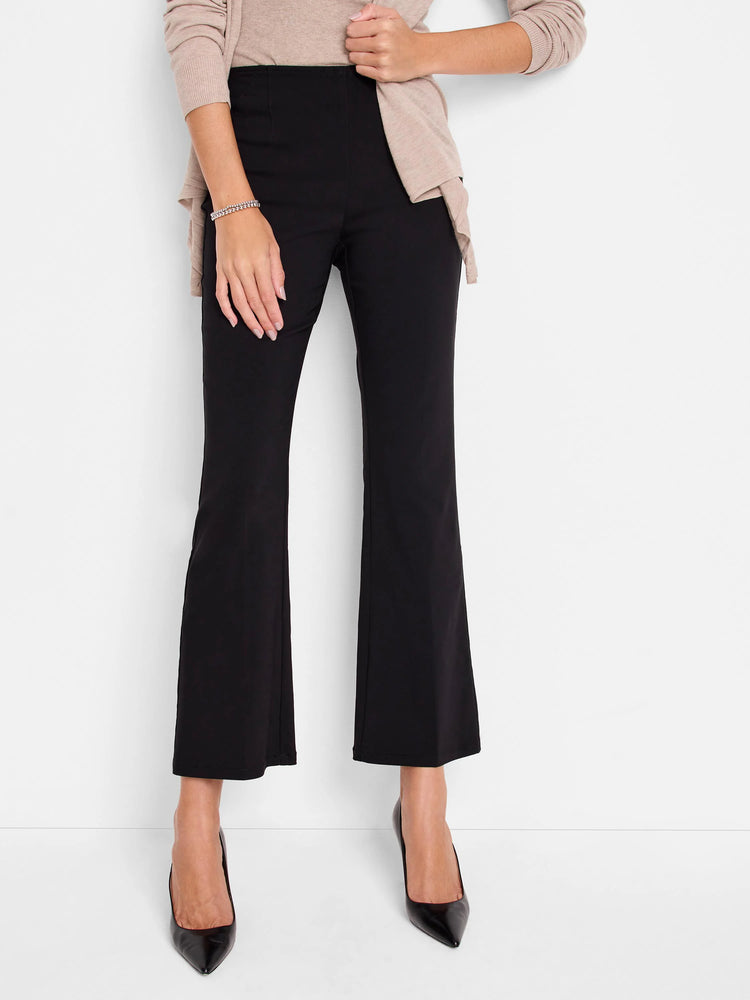 Black bootcut pull-on pants;  model wearing black heels against a white background.  Slight flare at the bottom.