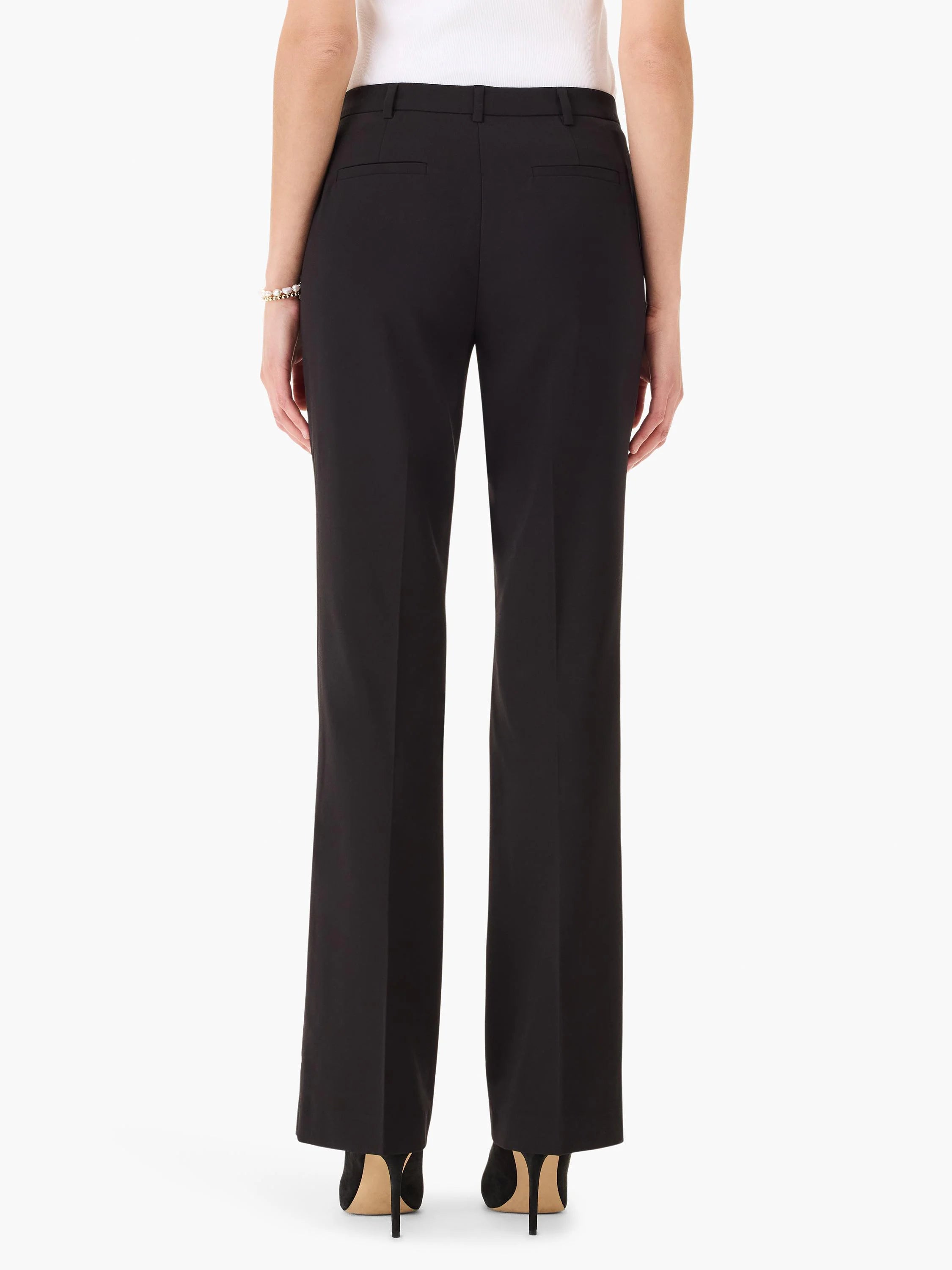 Here's alt text for the image, aiming for under 125 characters:

Black bootcut trousers shown from behind.  The pants...