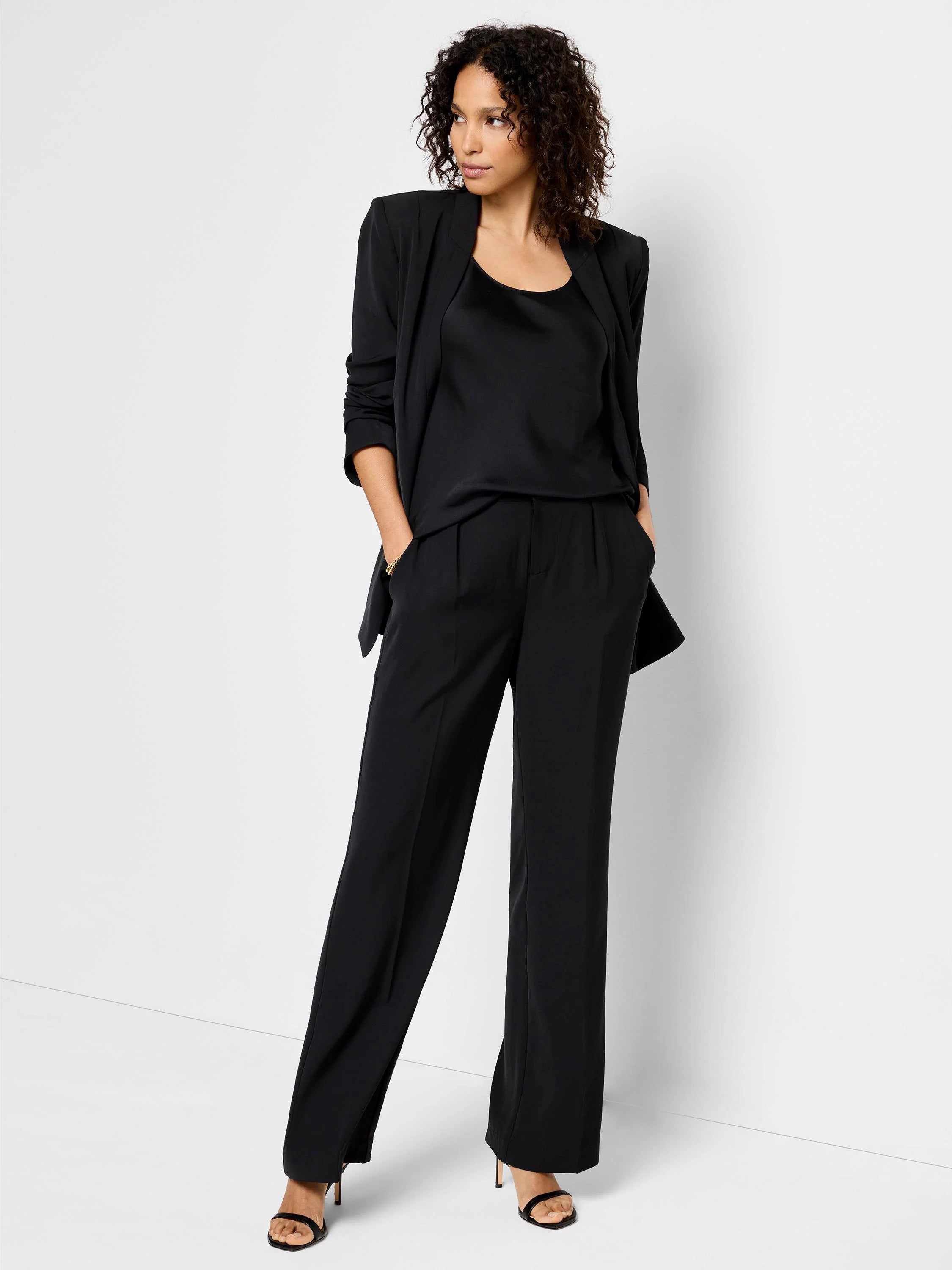 Black wide-leg trousers; model wears a black top and jacket.  Pleated front.
