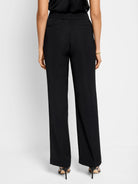 Here's alt text for the image, under 125 characters:

Black wide-leg trousers, shown from the back.  Elastic waistband,...