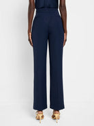 Here's alt text for the image, following your specifications:

"Navy blue wide-leg trousers; back view.  Elastic...