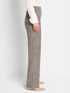 Gray and beige tweed wide-leg pants shown on a model.  The pants have a subtle textured pattern.