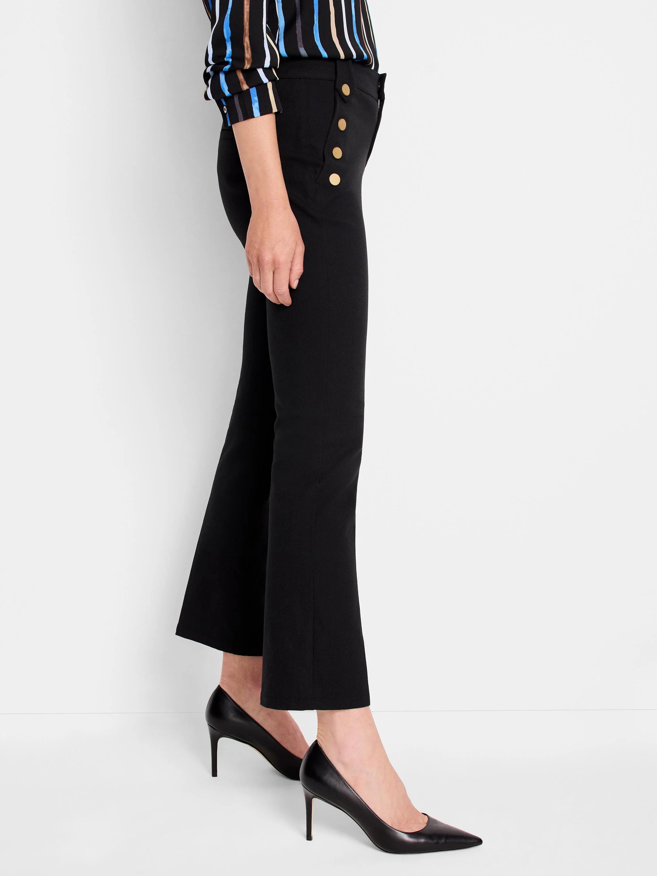 Black cropped flare pants with gold buttons down the side.  Shown on a model wearing black heels.