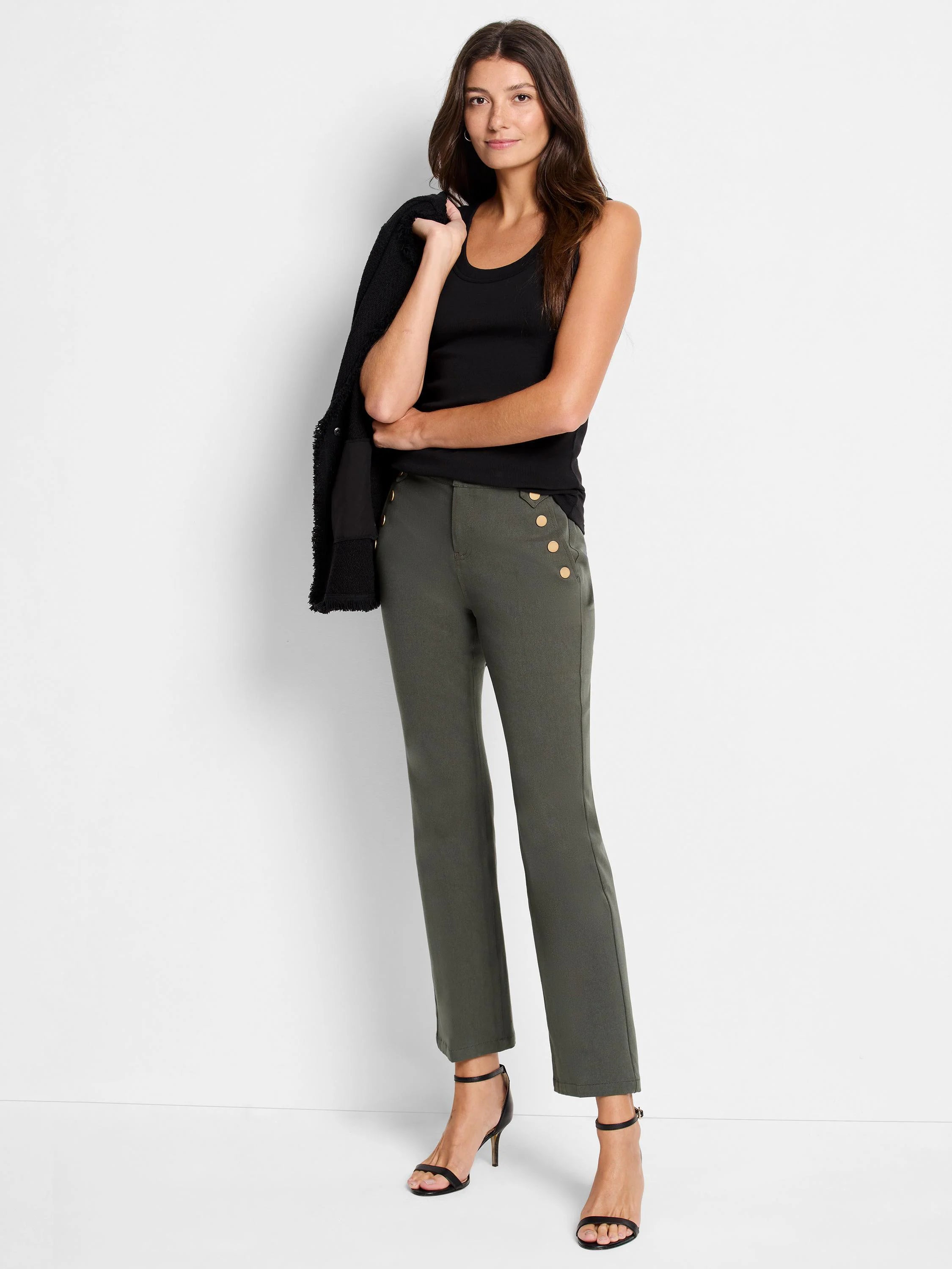 Olive green cropped pants with gold buttons; model wears black top and shoes.