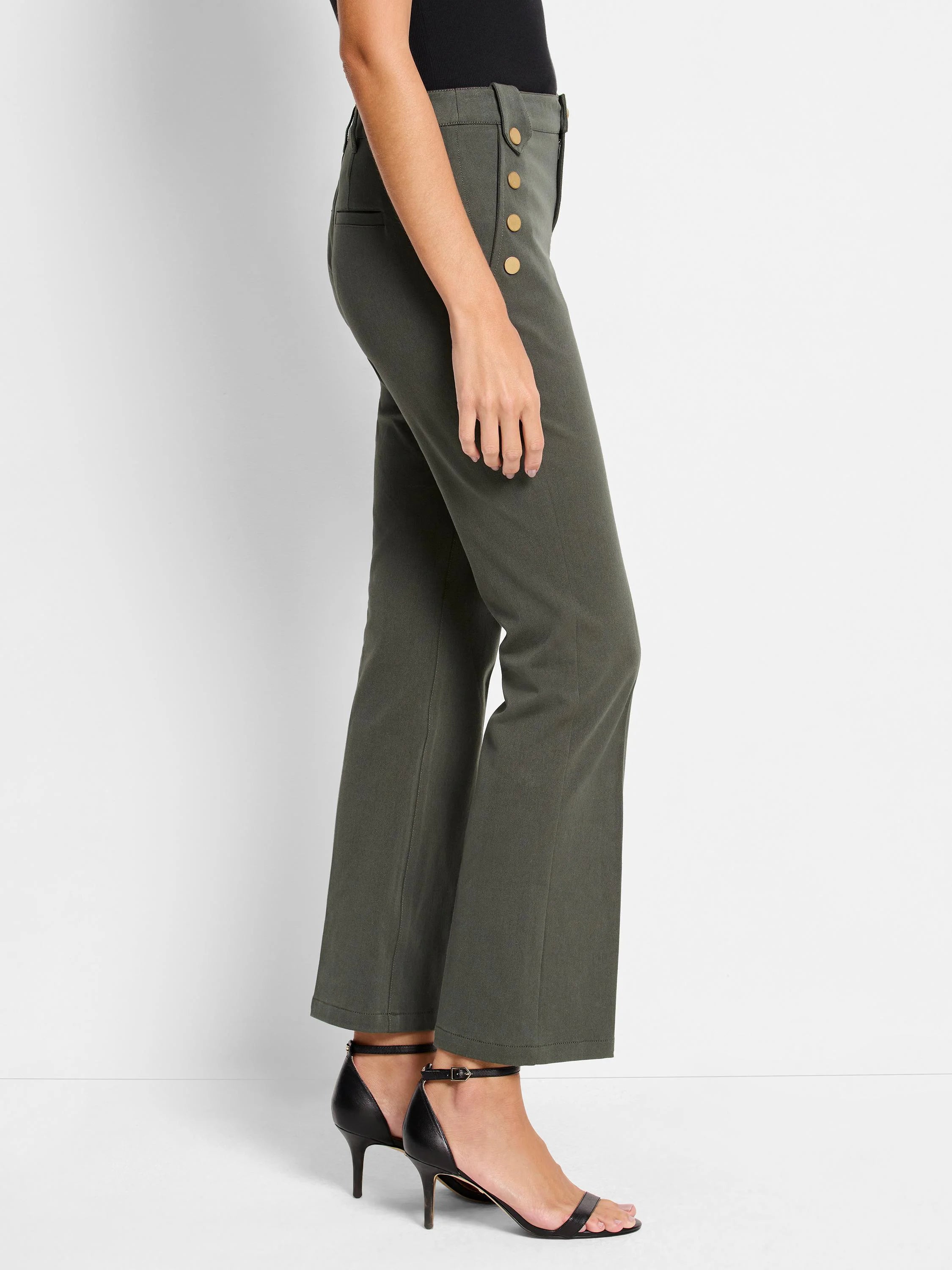 Olive green, bootcut pants. Gold buttons on side. Shown with black heels.