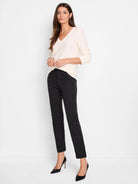 Black straight-leg pants, smooth texture, shown on a model with an above-ankle fit.