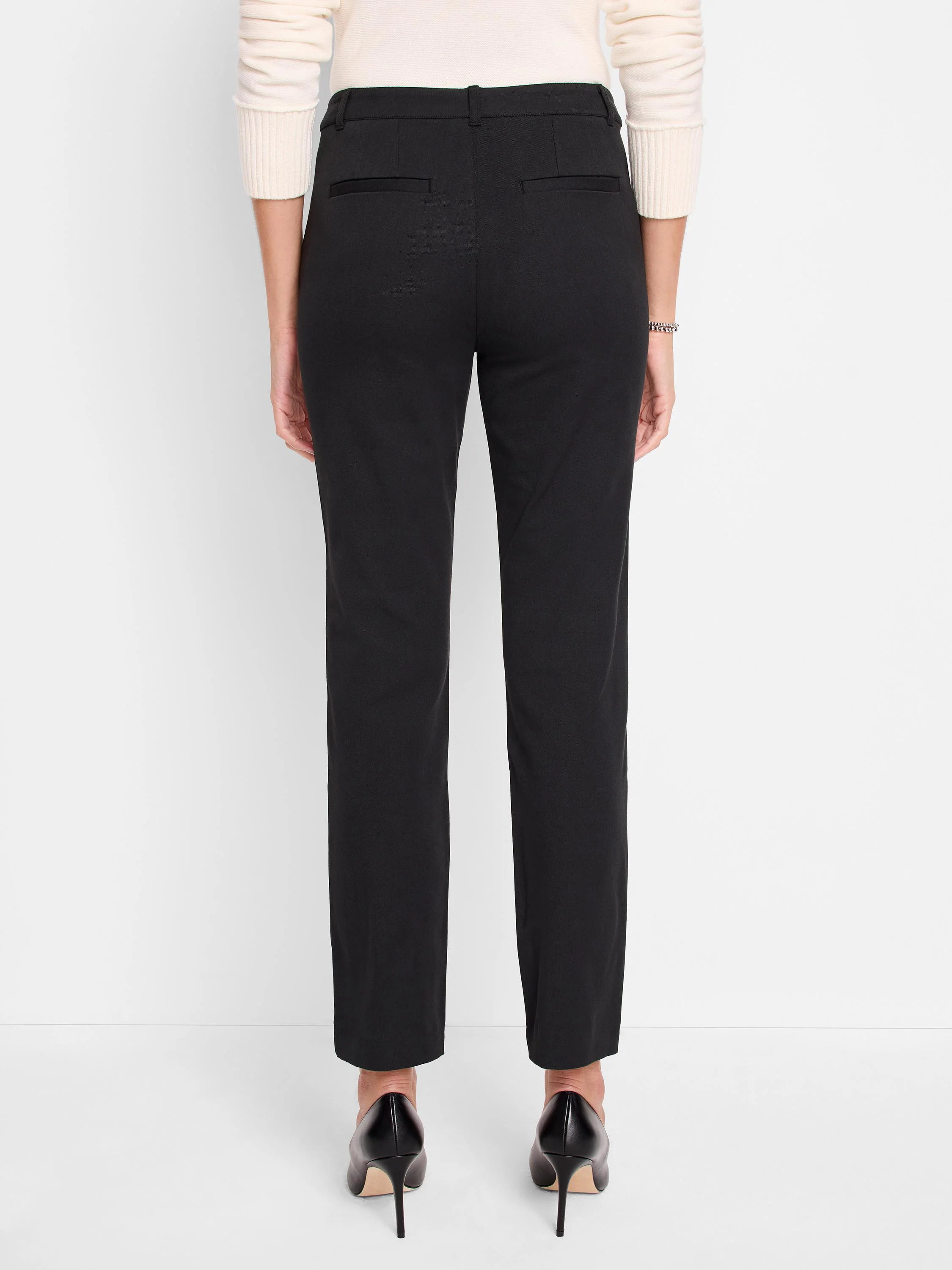 Black straight-leg pants shown from behind, featuring two horizontal back welt pockets and belt loops.
