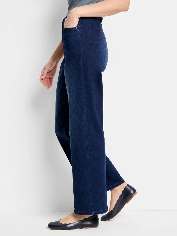 Dark wash, wide-leg jeans shown on a model.  The jeans are a deep blue.