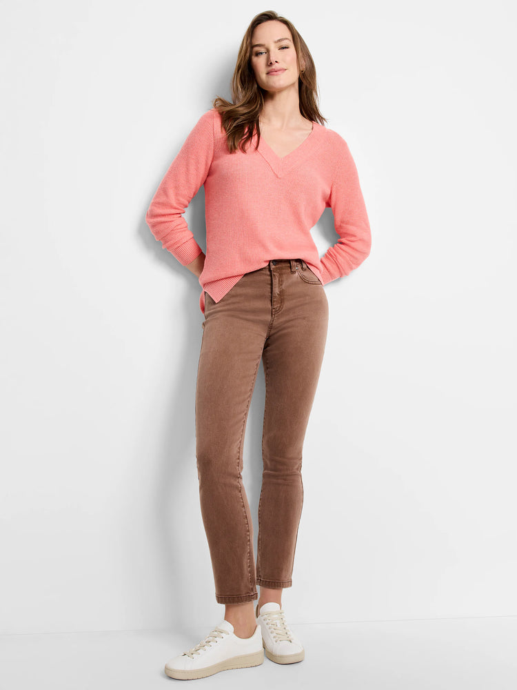 Mocha brown straight ankle jeans, slim-fit on a model.