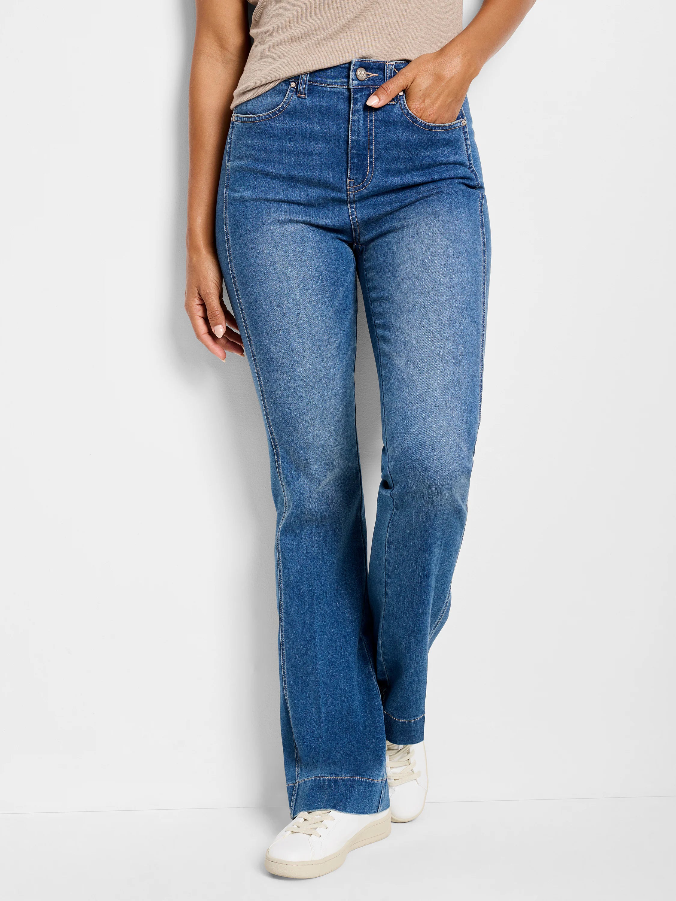 Medium blue bootcut jeans with visible side panels, high waist, and contrast stitching detail.