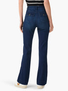 Dark blue high-waisted bootcut jeans, back view, with two flap pockets & gold-toned buttons.