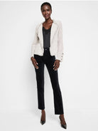 Black velvet straight-leg ankle pants on a model.