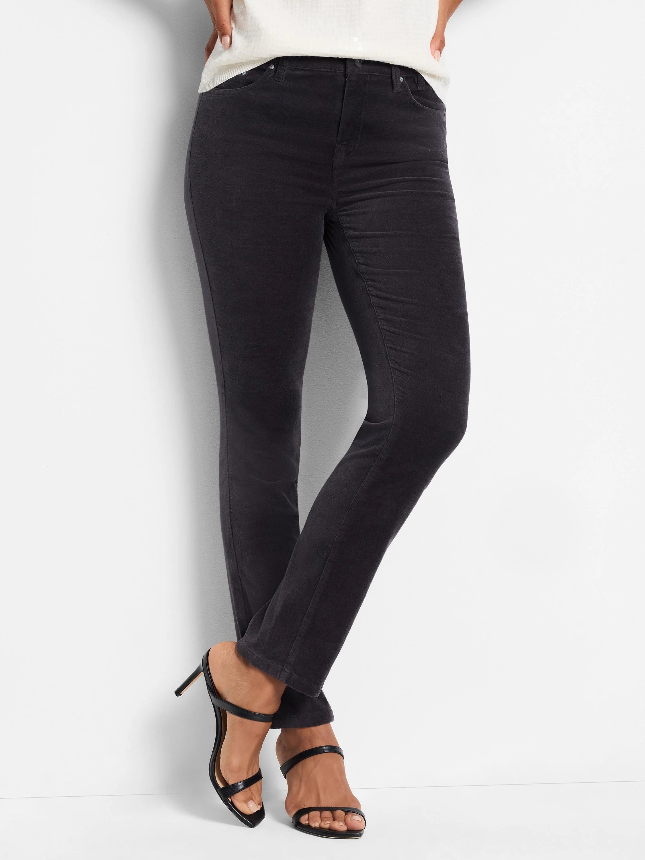 Dark gray velvet straight-leg ankle pants.  Model is wearing them with black heels.