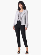 Black straight-leg pants on a model.  The pants are shown with a light gray tweed jacket and black shoes.