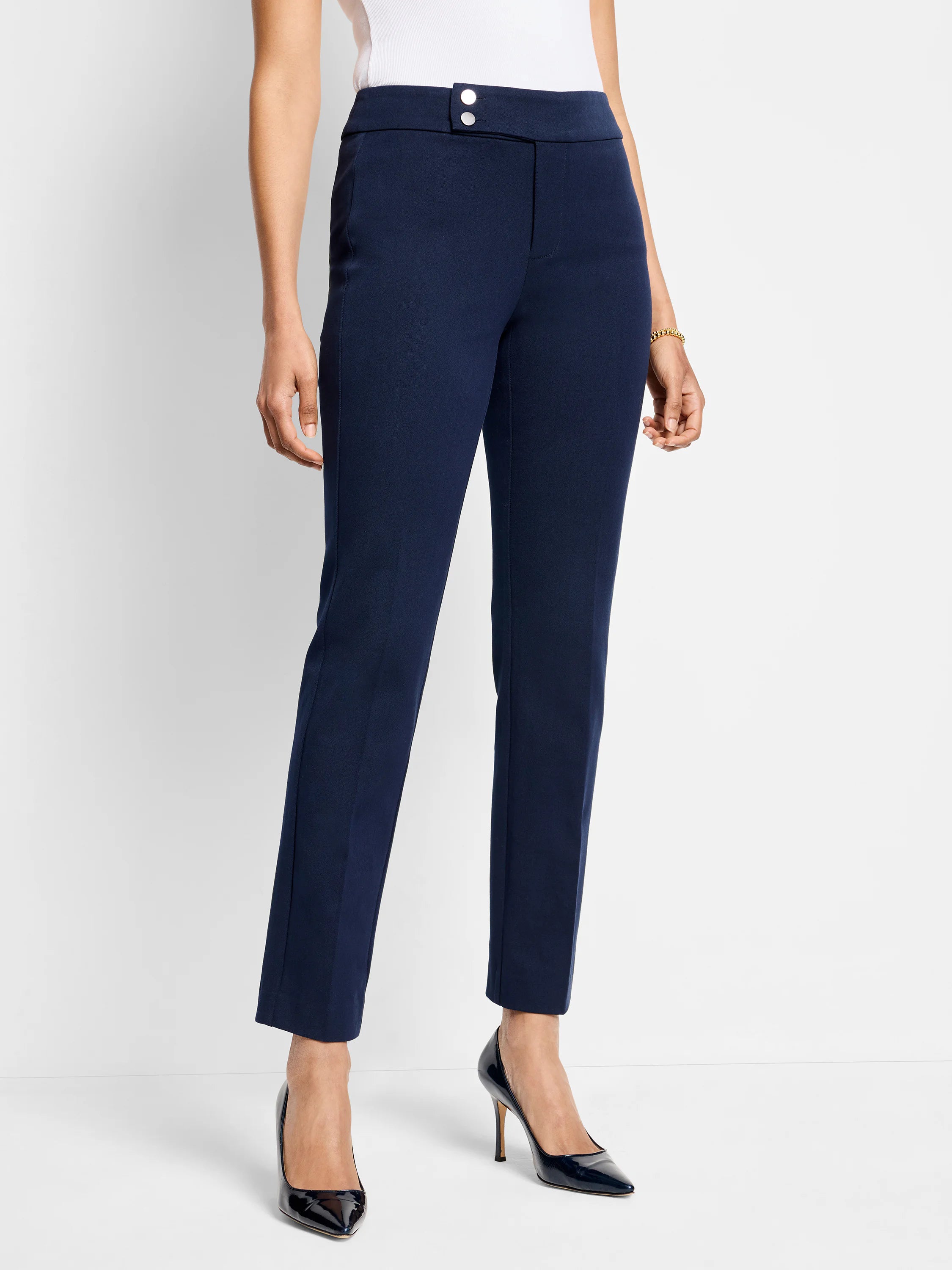 Dark navy straight-leg pants;  mid-rise waist,  two visible buttons.