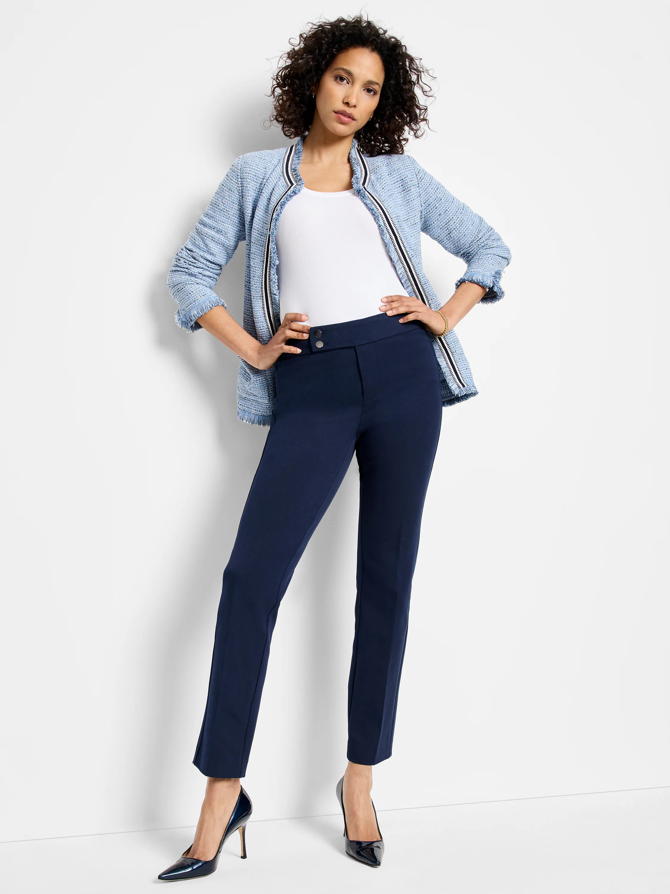 Navy blue straight-leg pants;  model is wearing them with light blue jacket & dark heels.  Two-button closure visible.