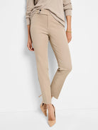 Beige straight-leg pants;  model is wearing light beige shoes.  Two dark buttons at waist.