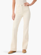 Off-white high-waisted bootcut jeans, with front pockets and a visible button closure.