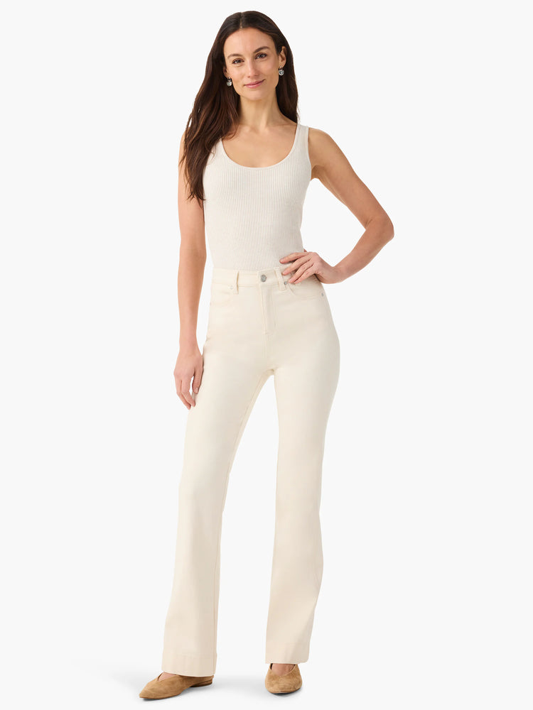 Cream bootcut jeans with side panels.