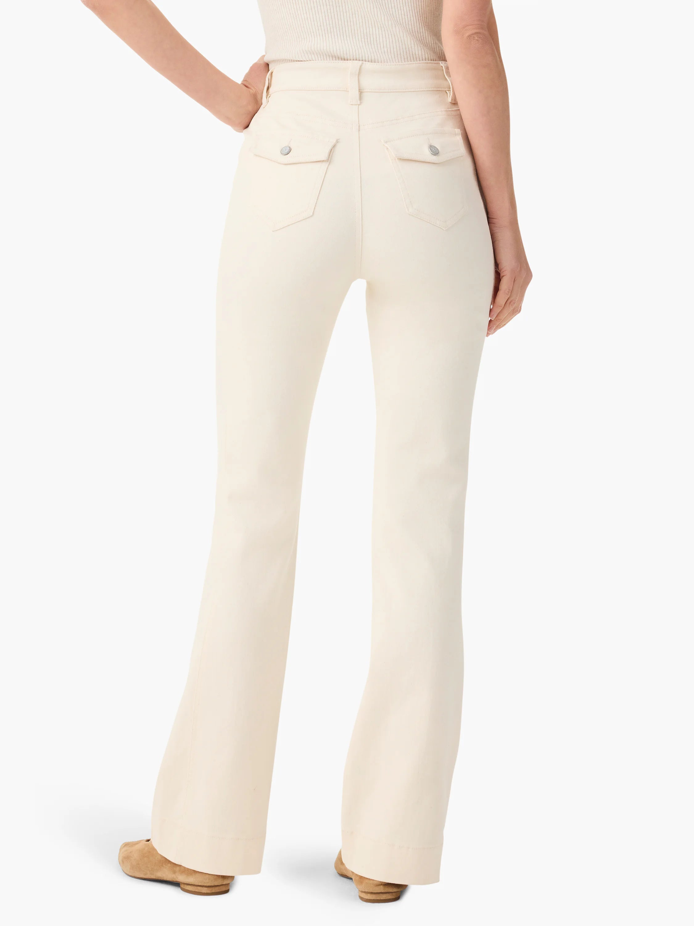 Cream bootcut jeans, back view on model. Features high waist, two flap pockets with silver buttons.