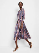 Midi shirt dress, vertical stripes in pink, purple, blue, and dark gray.  Features a belt.