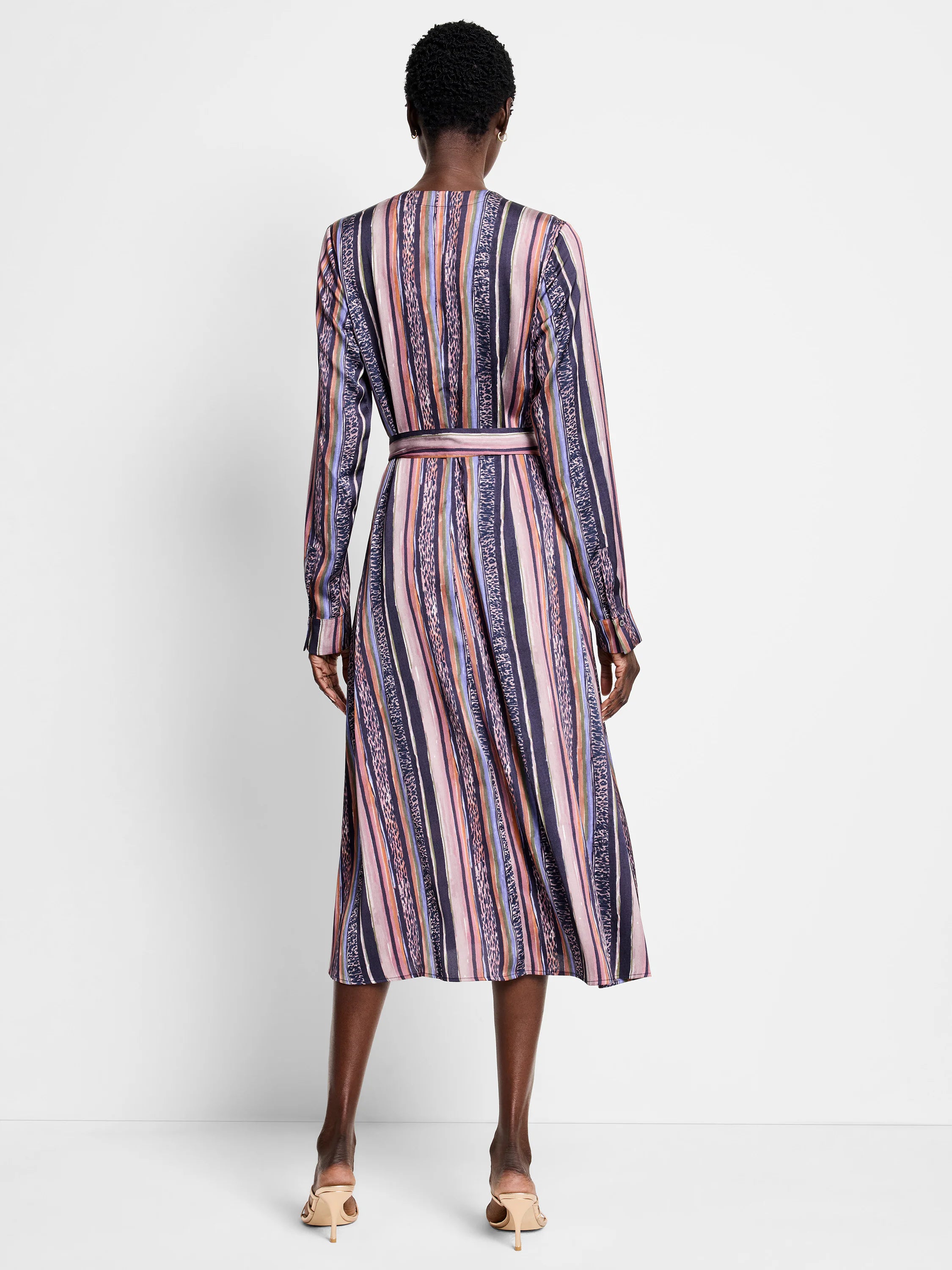 Midi dress, purple, pink, orange, and beige vertical stripes; animal print accents.  Long sleeves, belted waist.
