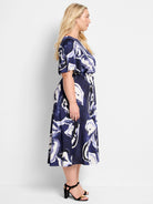 Midi dress, navy blue and off-white watercolor vine print, belted waist, short sleeves.