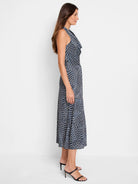 Midi dress, sleeveless, cowl neck. Dark blue, white, and light blue geometric print. A-line silhouette.