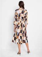 A-line midi shirt dress in brown, beige, and light blue geometric print.  Three-quarter sleeves, belted waist.
